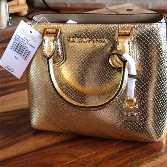 Michael Kors Handbags - Price reduced! Michael Kors gold handbag